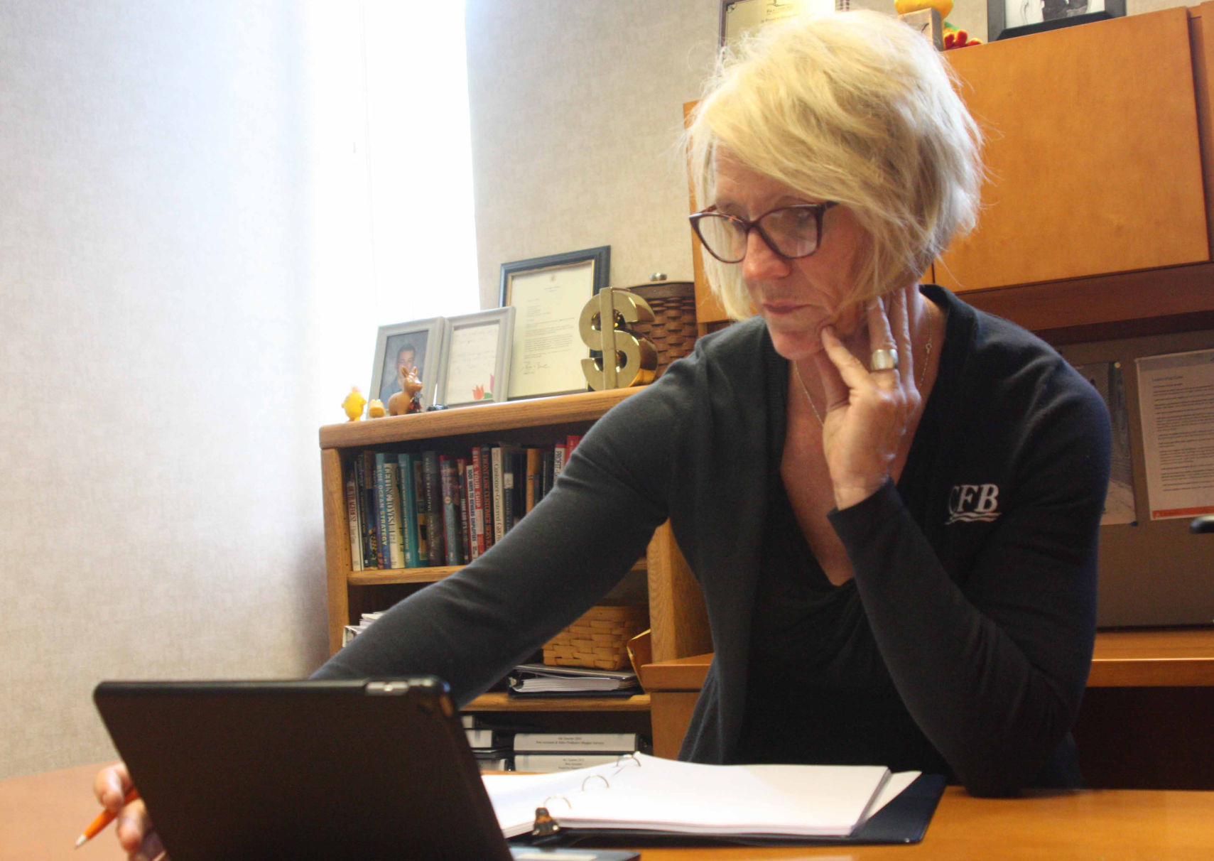 Becky Peterson sits at desk 2